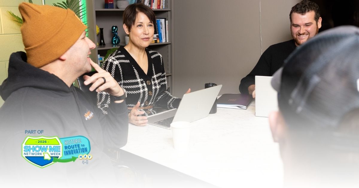 Small group sits and chats at table